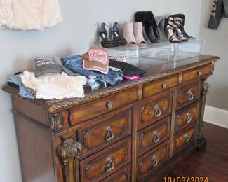 Dresser chest   Clothes include shorts, tops, hats.  Dress Shoes and boots.