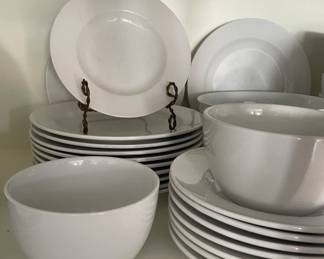 White bowls, plates.   Has marks inside and on plates