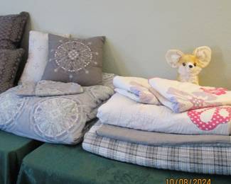 Bedding set on left is Queen.  Quilt with 2 shams is full size.  Plaid is full size