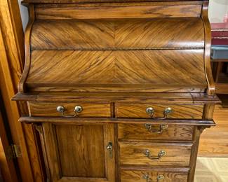 GORGEOUS sold wood roll top desk.  Reserve will be set.  Pull out writing area. 