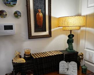 Old television cabinet doubles as storage.  Solid wood. Great repurposed piece. 