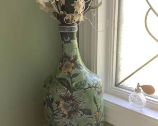 Many faux arrangements and vases