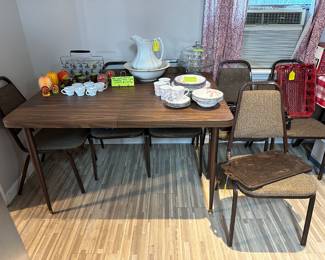 Rectangular dinette set with one leaf and six chairs