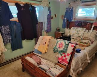 Lots of bedding and some nice quilts! Vintage clothing!
