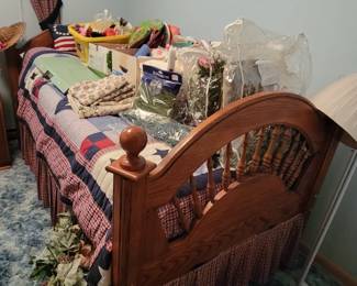 Wooden twin size bed with headboard and footboard. 