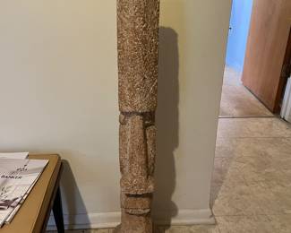 tall stone or plaster tiki