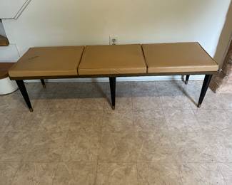 mid century bench tear on one cushion