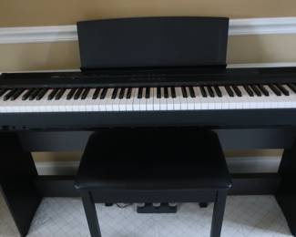 Yamaha  digital piano   P-105.  There  is  also  a  bench.