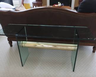 glas   top library table  with gold bar  below