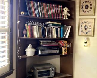 large collection of cookbooks toaster oven