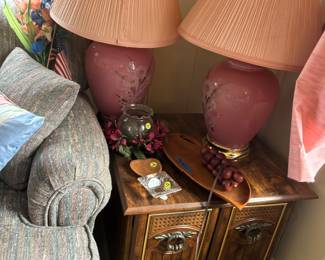 One of the end tables and pink lamps.