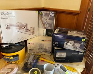 Brand new water faucets still in the boxes