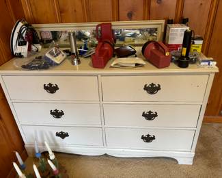 Dresser with mirror behind it-mostly likely vintage