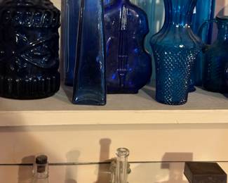 Lots of colored glass and antique bottles