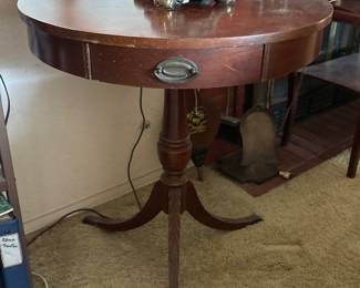 vintage mcm round drum  with claw feet table