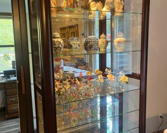 China cabinet or display cabinet.  Door slides for access into the cabinet 