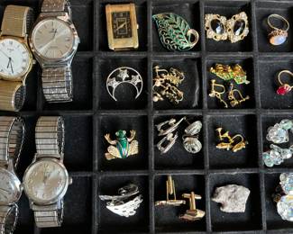 Hundreds of pieces of vintage costume jewelry; vintage wristwatches.
