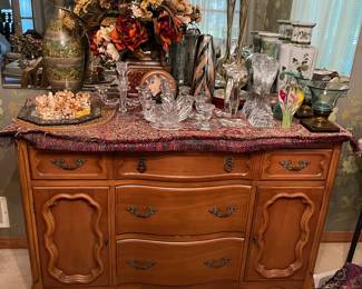 Credenza/buffet by Bernhardt; extensive selection of fine glassware and pottery.