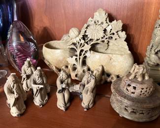 Soapstone carvings and Chinese mudman pottery.