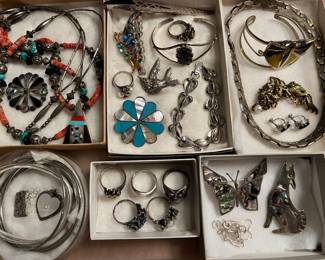 Sterling silver jewelry, including a vintage Coro Craft butterfly brooch, a Tim Guerro bracelet, and a Kai-Yin Lo dragon brooch.