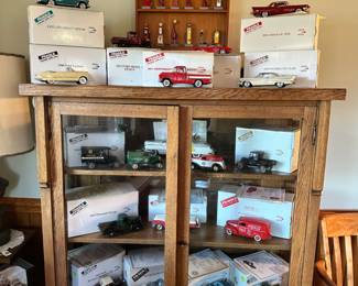 Danbury Mint cars and trucks, antique cabinet 