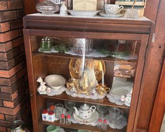 Vintage display case with various items