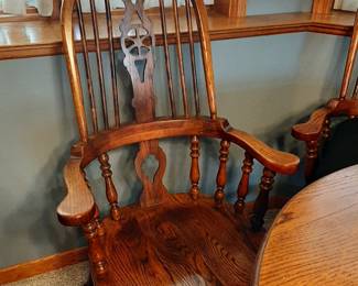 One of two Captains Chairs w/Amish Pedestal Table