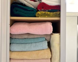 Large assortment towels, bedding