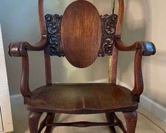 Carved wood rocking chair