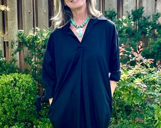 DAWN SHOWING OFF "THE BUBBLE LIFESTYLE" BLACK DRESS AND FINE JEWELRY.