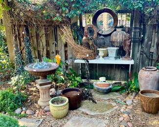 PATIO AREA WITH POTS AND STATUARY.