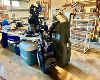 GARAGE FULL OF BIKING, GOLF, TOOLS, AND GARDEN.