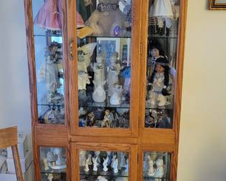Lighted curio cabinet.  Several collections including MSU ornament