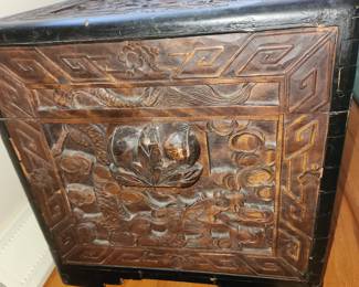 large, ornate, carved trunk (side)