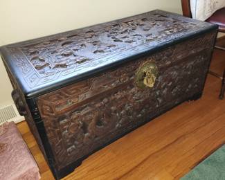 large, ornate, carved trunk