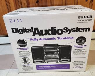 New in sealed box AIWA Digital Audio System: turntable, radio, 3 CD player and speakers. Model Z-L11