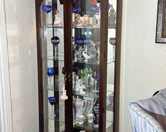 One of two, Cherry Curio Cabinets... this one filled with LLADRO Figurines and Cut-to-Clear Crystal Stemware