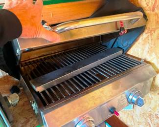 A table top portable stainless steel grill