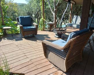 Comfortable wicker patio furniture, porch swing and fire pit as well
