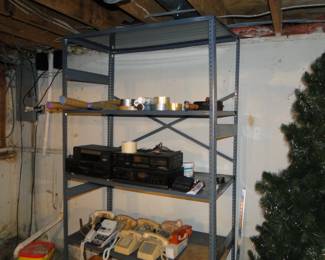 Another great shelving unit filled with phones and such