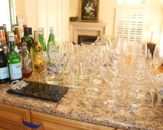 Specialty liquor, wine, tequila, whiskey, and champagne. Marble Arthur Court cheese board and ice bucket. Waterford wine glasses and champagne flutes. 