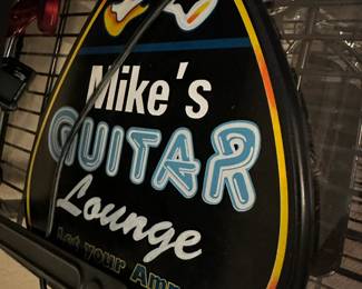 mikes guitar lounge advertising sign