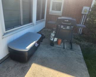 Several storage bins and a nice grill 