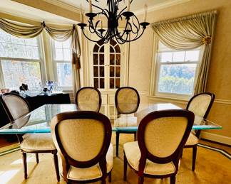 Glass-topped table on travertine bases