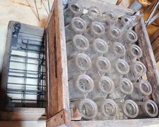 1557 - 2 Wooden Dairy Crates, 1 with bottles
