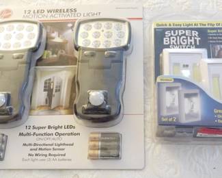 1203 - Motion Activated Lights and Lighted Light Switches Both New in Packaging
