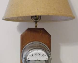 1144 - Wood Lamp with Electric Meter You are buying a used as-is electric/electronic item. We do not guarantee all components are present, and if it is not expressly stated, it is untested.

