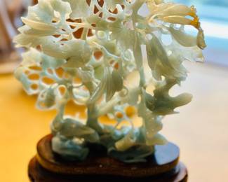Carved jade figurine on stand