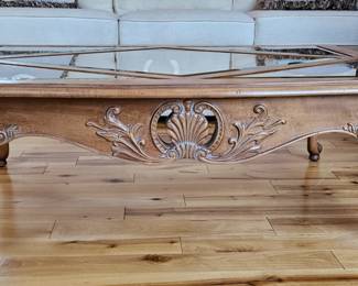 Wood coffee table with glass top
