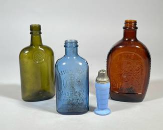 (4pc) ANTIQUE COLORED GLASS BOTTLES | Including: blue Milk of Magnesia bottle from The Chas. H. Phillips Chemical Co., a green glass bottle from WM. Sanderson & Son Ltd. From Leith Scotland, 1776 Log Cabin syrup bottle, and blue milk glass salt shaker. - h. 8.25 x w. 2.5 x l. 4.5 in (largest)